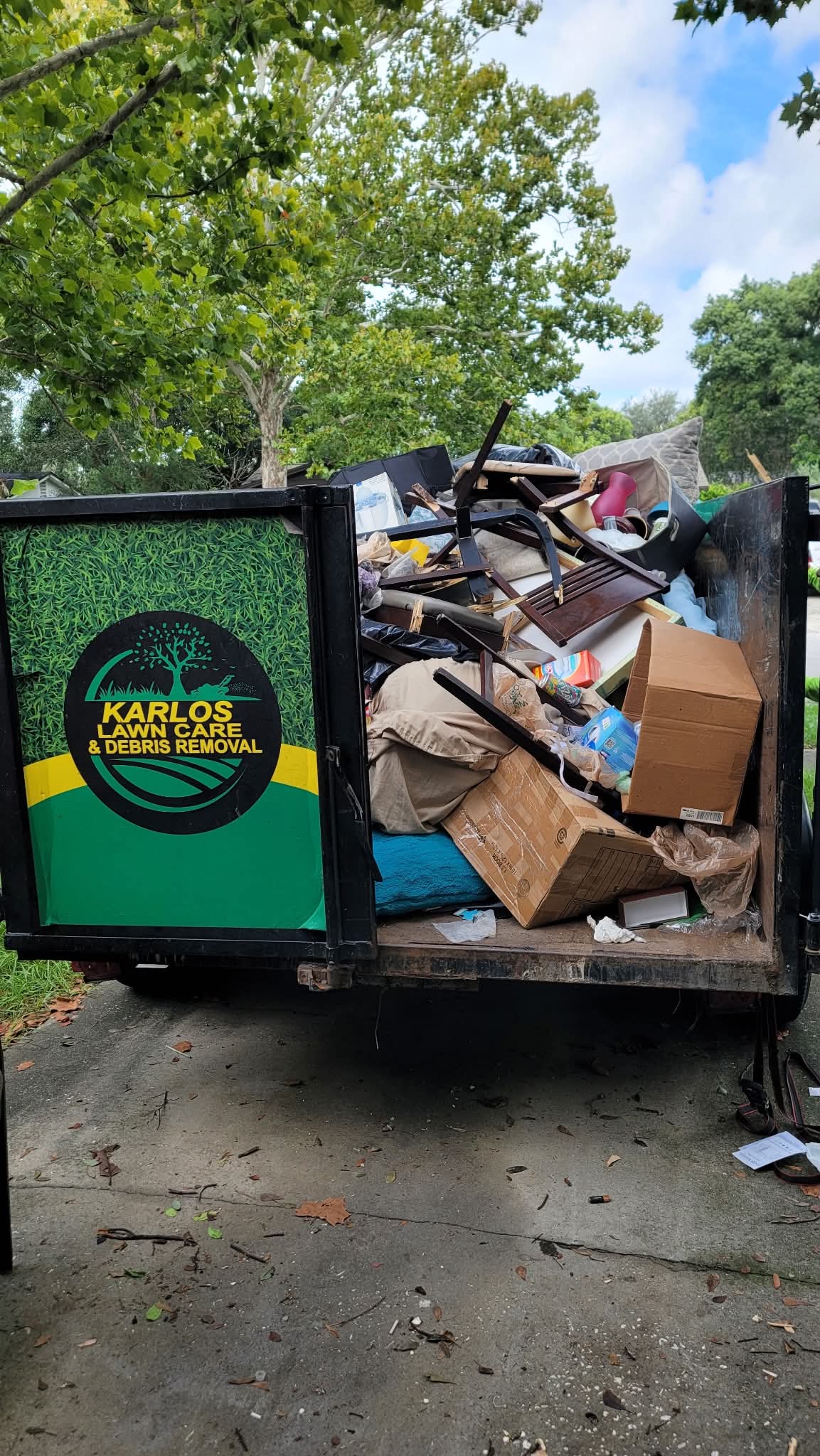 Karlos debris removal trailer filled with household items